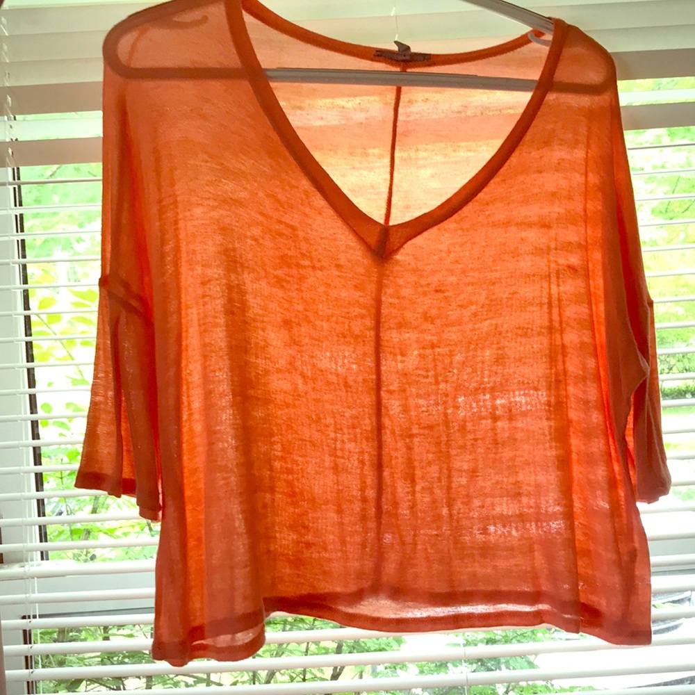 Orange shirt.